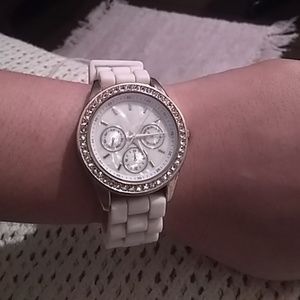 Rhinestone face watch with rubber white band.